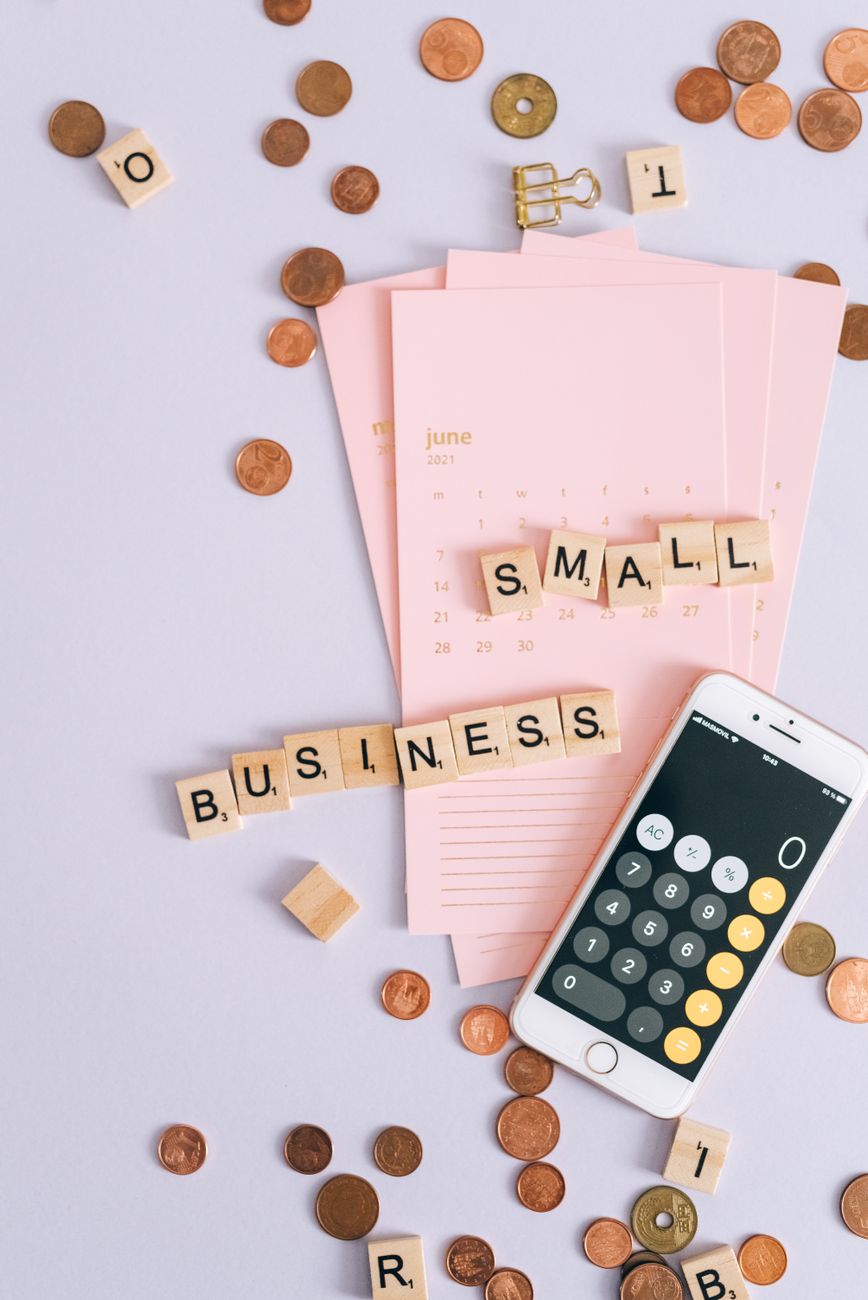 Business essentials with calculator and coins