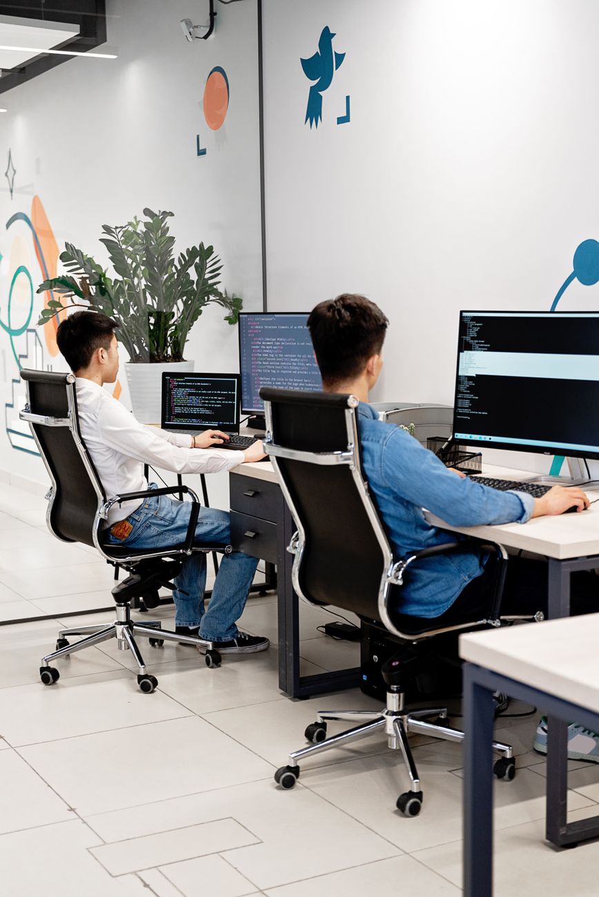 Two programmers collaborating on code